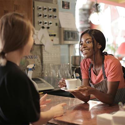 woman serving a hot drink